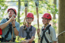 Boy Scouts learn proper safety procedures while on a zipline