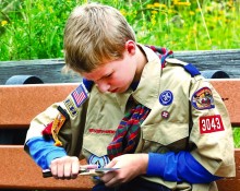 Cub Scout Ben Prunuske, 10, practices knife craft while working to earn his whittling chip award Thursday. He practiced while waiting for other Scouts to arrive at Hartley Nature Center. (Steve Kuchera / skuchera@duluthnews.com)