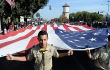 Troop 257 from Clovis, CA, holds huge American flag during Fresno Veterans Day Parade // Photo courtesy of The Fresno Bee