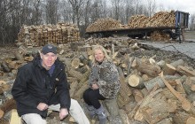 Gary Hartley, community and governmentrelations director for the Boy Scouts of America Summit Bechtel Reserve, and MargaretO’Neal, executive director of theUnited Way of Southern West Virginia, sit a on pile of fire wood the Summit is donating to the United Way to be distributed to families in need.Rick Barbero/ The Register-Herald